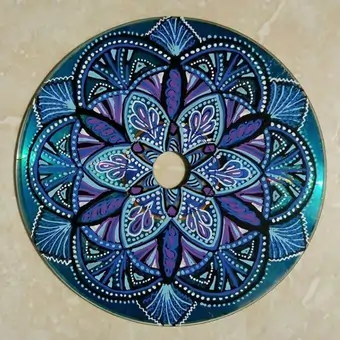 Upcycled CD intricately hand-painted into a floral mandala using blue and purple gradients.